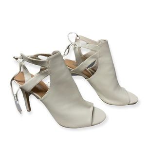 Brash white lace up heels